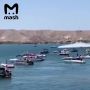 Лодка с пассажирами на борту взлетела в воздух и прокрутила сальтуху во время гонок в Аризоне