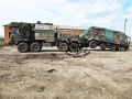 Ремонтно-эвакуационная машина РЭМ-КЛ утаскивает в тыл подбитую украинскую командно-штабную машину Р-145БМ (на базе БТР-60ПБ) в Курской области