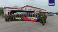 Вернувшиеся в ходе финального дня обмена военные РФ развернули флаги России, СССР и Российской империи